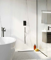 wetroom with marble and white mosaic floor